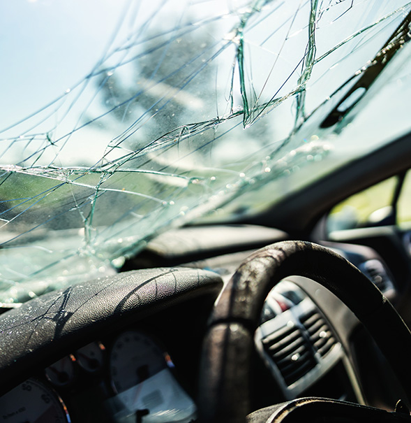 Closeup of crashed car window in car accident.