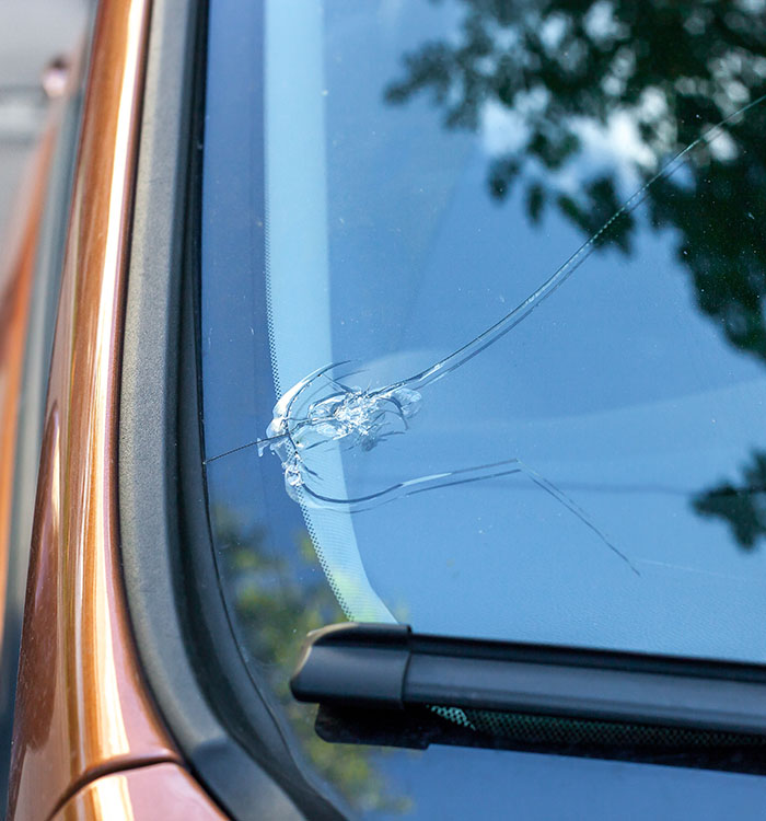 Broken car windshield glass from stone